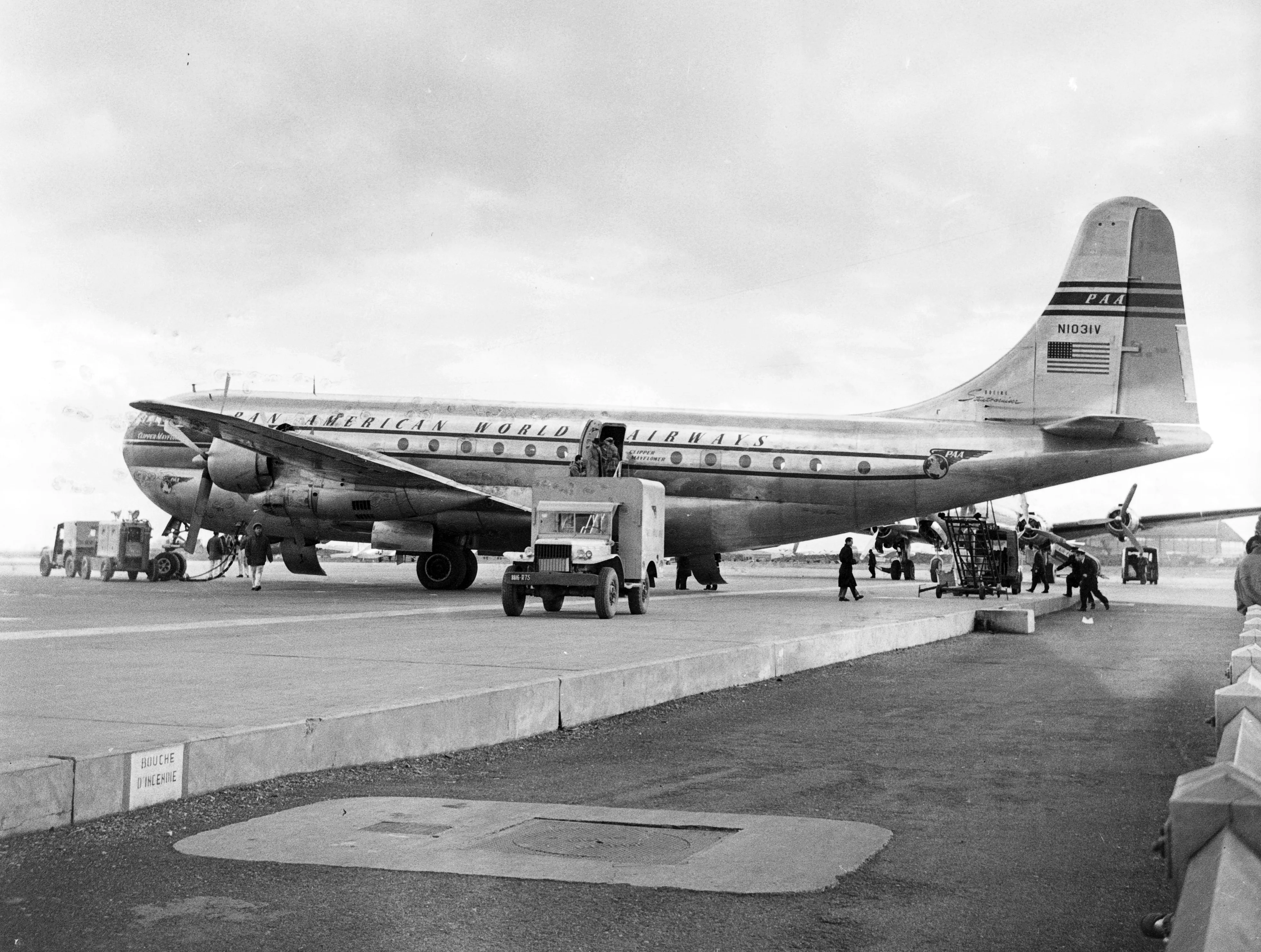 Boeing 377 Stratocruiser double-deck propliner in Pan American World Airways livery at Paris-Orly airport, circa 1950.