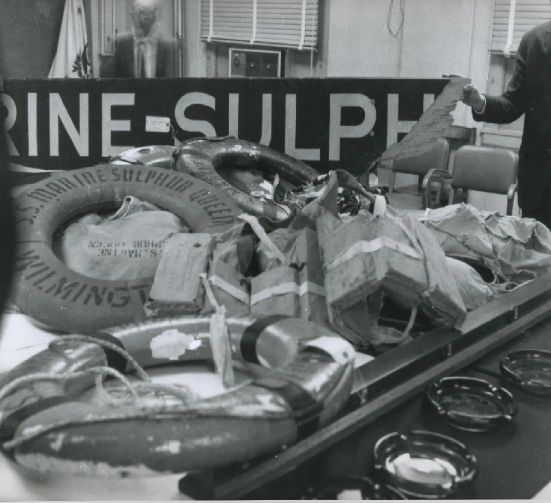 US Coast Guard display of debris recovered from the missing SS Marine Sulphur Queen, including a life ring and other items.